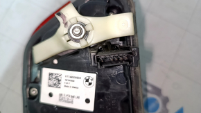 The inner tailgate light, left, BMW 3 G20 19-21, is worn, and has a bump.