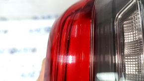 The right inner taillight of a BMW 3 G20 19-21 is worn and scratched.