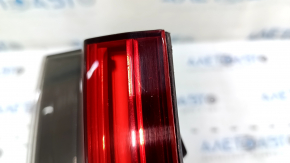 The right inner taillight of a BMW 3 G20 19-21 is worn and scratched.