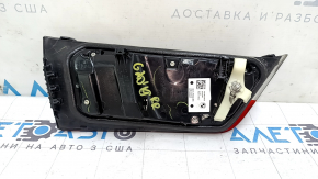 The right inner taillight of a BMW 3 G20 19-21 is worn and scratched.