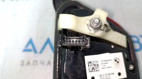 The right inner taillight of a BMW 3 G20 19-21 is worn and scratched.