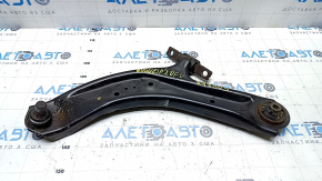 The lower front left control arm of a Nissan Rogue Sport 17-22 under R19 has a torn silent block.
