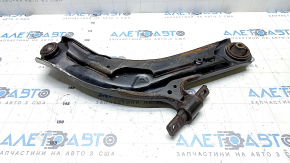 The lower front left control arm of a Nissan Rogue Sport 17-22 under R19 has a torn silent block.