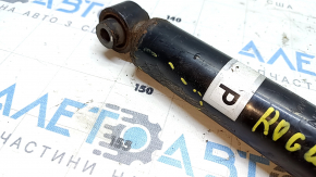 The rear left shock absorber of the Nissan Rogue Sport 17-22 is dented.