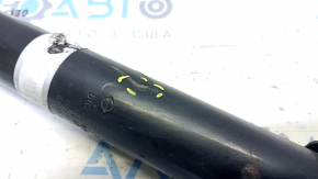 The rear right shock absorber of the Nissan Rogue Sport 17-22 is dented.