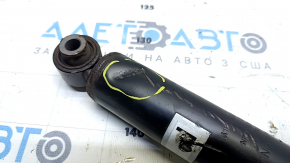 The rear right shock absorber of the Nissan Rogue Sport 17-22 is dented.