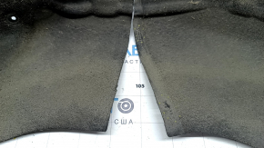 The rear right fender liner of a BMW X5 F15 14-18 is torn along the seam.