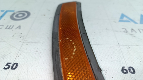 The front bumper reflector, left, BMW 3 G20 19-24, is worn.
