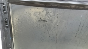 The sunroof glass of a BMW 3 G20 19-24 is covered in soot.