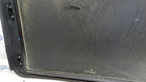 The sunroof glass of a BMW 3 G20 19-24 is covered in soot.
