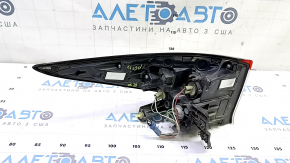 The upper right wing light of a Toyota Prius 50 19-22 is missing a chip and has scratches.