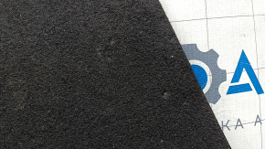 The trunk floor of a 2016-2017 Kia Optima is black, worn, has dents, and needs cleaning.