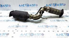 The Nissan Rogue Sport 20's exhaust pipe and catalytic converter are rusty and the bolts are broken.