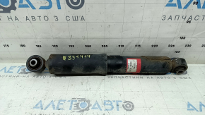 The rear left shock absorber of the Lexus NX300h 15-21 is rusty.