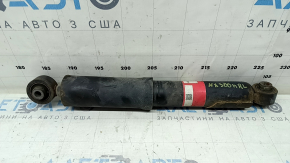 The rear left shock absorber of the Lexus NX300h 15-21 is rusty.