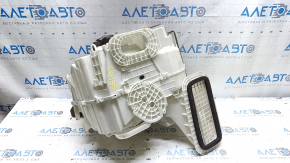 The bare heater housing of a Nissan Rogue Sport 19-22 dual zone for heated seats has cracks and a broken latch.