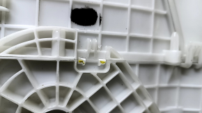 The bare heater housing of a Nissan Rogue Sport 19-22 dual zone for heated seats has cracks and a broken latch.