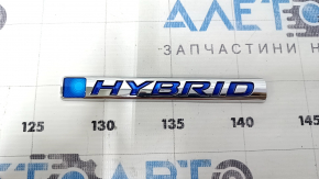 Left hybrid wing emblem for a 1993 Honda Accord.