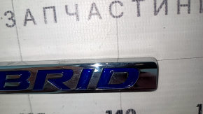 Left hybrid wing emblem for a 1993 Honda Accord.