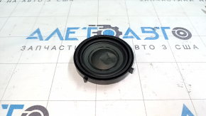 The driver's footwell speaker on the front panel of the BMW i3 14-21 is dented.