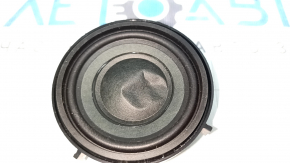 The driver's footwell speaker on the front panel of the BMW i3 14-21 is dented.