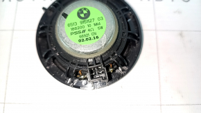 The driver's footwell speaker on the front panel of the BMW i3 14-21 is dented.