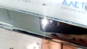 Trunk lid molding for a 1996 Honda Accord hybrid, restyling, chrome, scratches, and chrome defects.