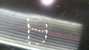 The front left fender of a Nissan Leaf 13-17 has a dented arch.