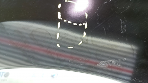 The front left fender of a Nissan Leaf 13-17 has a dented arch.