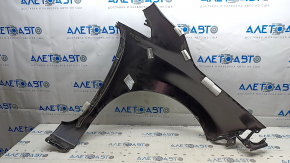 The front left fender of a Nissan Leaf 13-17 has a dented arch.