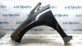 The front left fender of a Nissan Leaf 13-17 has a dented arch.