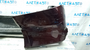 Bare rear bumper for a 1996 Honda Accord with single exhaust and no parking sensors, cracked.