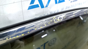 The front right door of a Toyota Venza 21-24 black model 202 is bare and dented.