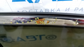 The front right door of a Toyota Venza 21-24 black model 202 is bare and dented.