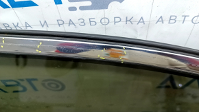 The front right door of a Toyota Venza 21-24 black model 202 is bare and dented.
