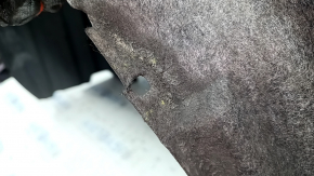 The front left fender liner of a Toyota Venza 21-24 has a torn mount.