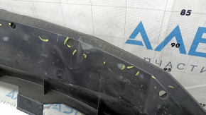 The lower front bumper absorber of a Toyota Venza 21-24 is pressed and worn.