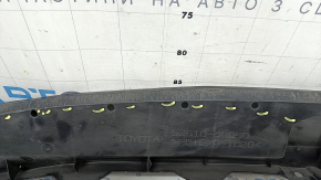 The lower front bumper absorber of a Toyota Venza 21-24 is pressed and worn.