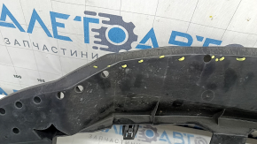 The lower front bumper absorber of a Toyota Venza 21-24 is pressed and worn.