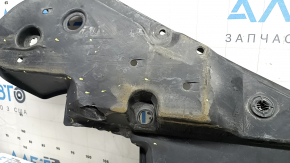 The front right underbody protection of Toyota Venza 21-24 is dented, scuffed, and has tears.