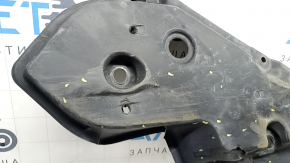 The front right underbody protection of Toyota Venza 21-24 is dented, scuffed, and has tears.