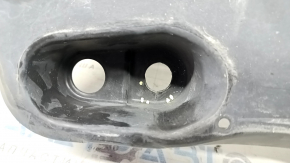 The front right underbody protection of Toyota Venza 21-24 is dented, scuffed, and has tears.