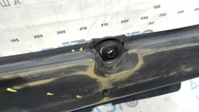 The front right underbody protection of Toyota Venza 21-24 is dented, scuffed, and has tears.
