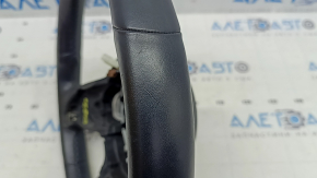 The steering wheel of a Mercedes GLC 20-22 is bare, black leather, heated, with scratches, tears, and dents.