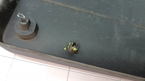 The platform for the front bumper number plate of the Mercedes GLC 300 20-22 has broken fasteners.