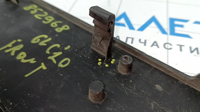 The platform for the front bumper number plate of the Mercedes GLC 300 20-22 has broken fasteners.