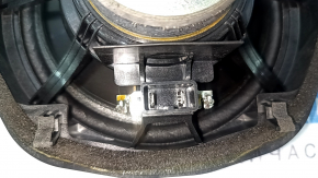 The left speaker on the rear shelf of a Honda Accord 13-17 has a broken edge.