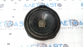The left speaker on the rear shelf of a Honda Accord 13-17 is dented, with chips on the edge.