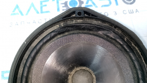 The left speaker on the rear shelf of a Honda Accord 13-17 is dented, with chips on the edge.