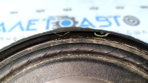 The left speaker on the rear shelf of a Honda Accord 13-17 is dented, with chips on the edge.